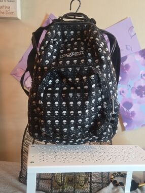 Jansport Black Backpack with White Skull Pattern